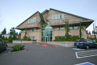photo of a building with parking cars