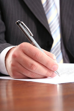 business man signing a form